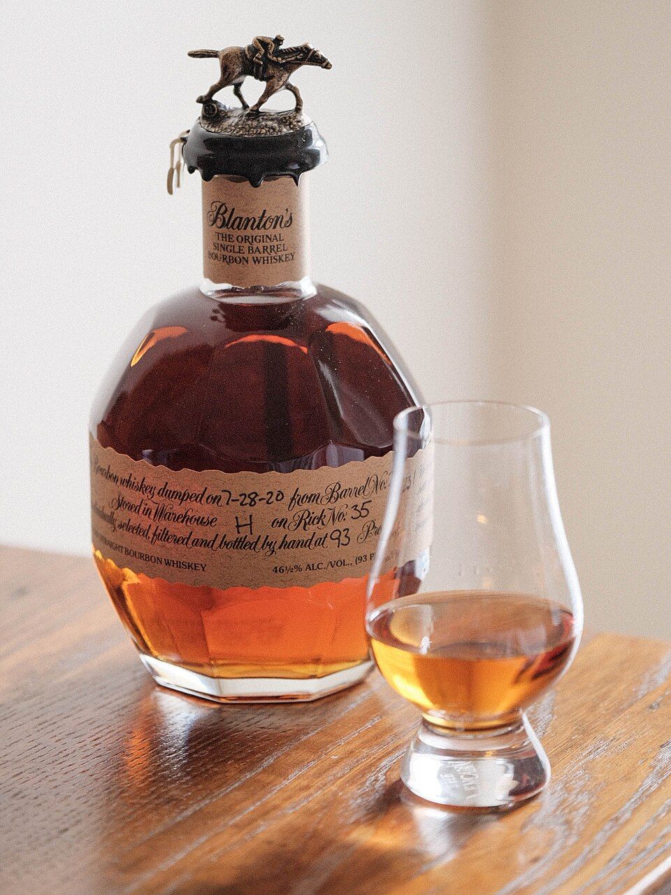 A bottle of Blanton's Original Single Barrel bourbon with a glass